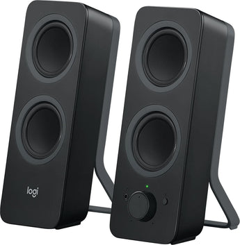 Logitech Z207 black Bluetooth computer speakers on a desk, showcasing the minimalist design.