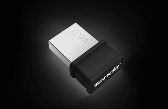 Tenda W311MI-W6 Wi-Fi 6 USB Adapter. A compact, black adapter providing next-gen wireless connectivity for laptops and desktops.