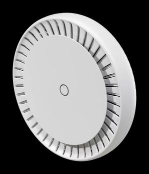 MikroTik cAP LTE12 ax: White, round ceiling access point with dual-band WiFi 6 and LTE connectivity for indoor use.