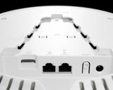 MikroTik cAP LTE12 ax: White, round ceiling access point with dual-band WiFi 6 and LTE connectivity for indoor use.