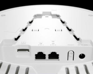 MikroTik cAP LTE12 ax: White, round ceiling access point with dual-band WiFi 6 and LTE connectivity for indoor use.