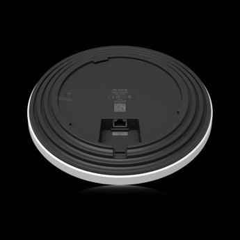 Ubiquiti UniFi U7 Pro XG ceiling-mounted access point. White, round design with multiple Ethernet ports for high-speed WiFi 7 connectivity.
