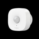 TP-Link Tapo T100 smart motion sensor; small white device detects movement for home security and automation when used with a Tapo Hub.