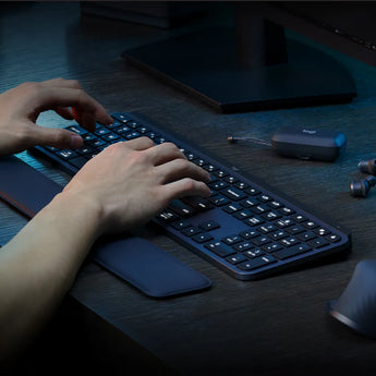 Logitech MX Keys S Graphite Wireless Keyboard: Low profile, backlit, with programmable keys for enhanced productivity.